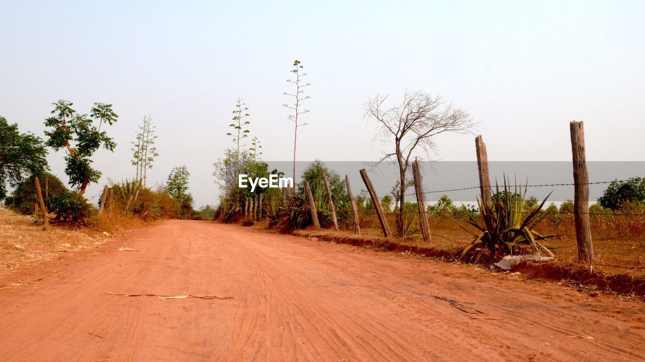 Empty road against clear sky