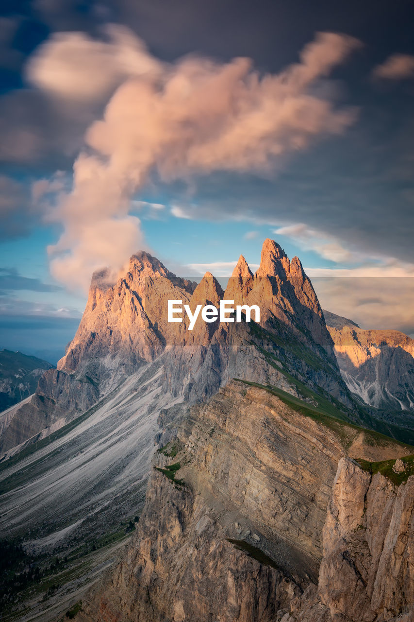 Scenic view of snowcapped mountains against sky during sunset