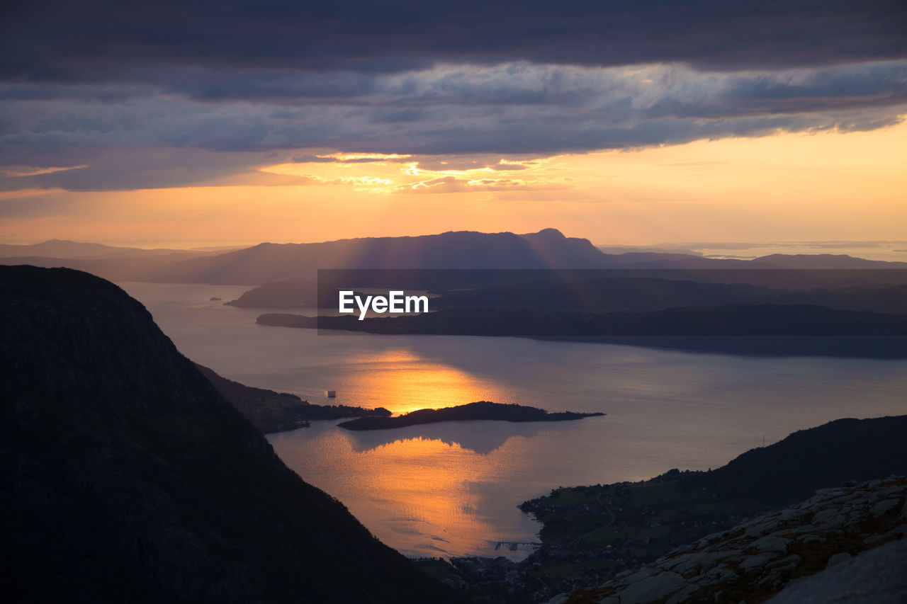 Scenic view of silhouette mountains against sky during sunset