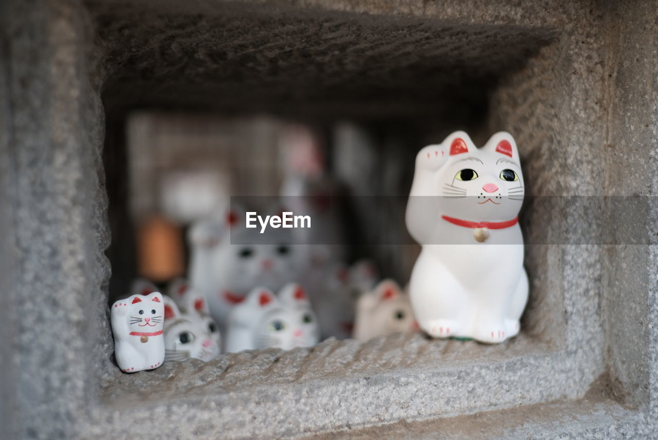 Close-up of cat figurines for sale in market