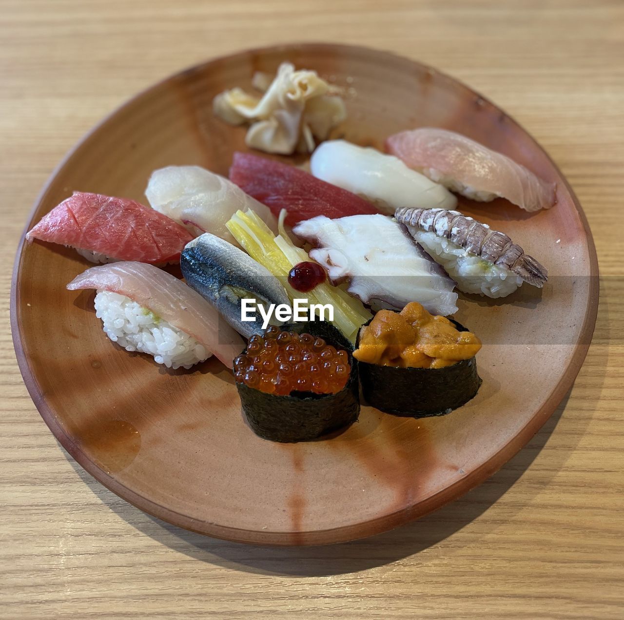 food and drink, food, healthy eating, cuisine, seafood, freshness, dish, sushi, wood, japanese food, asian food, wellbeing, no people, table, meal, indoors, culture, plate, rice, still life, vegetable, fish, japanese cuisine, high angle view, meat, animal