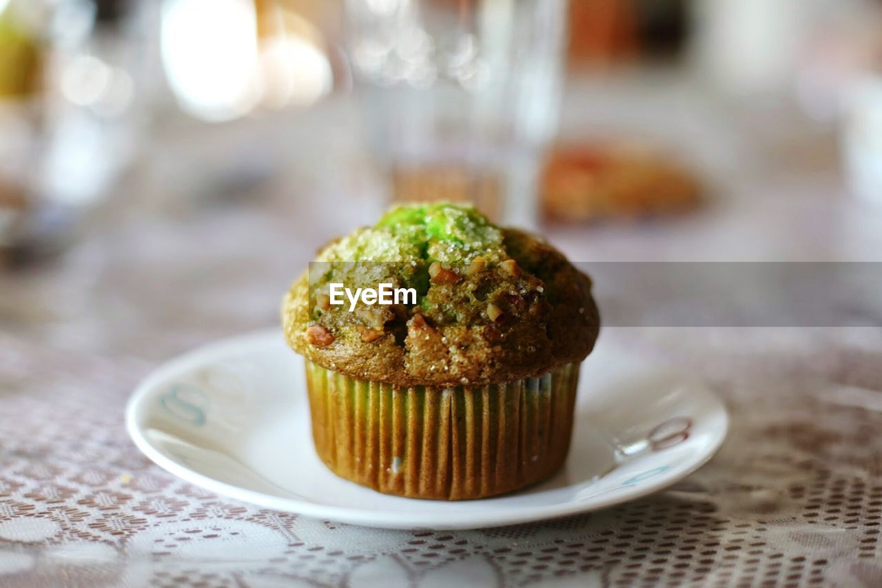 Close-up of muffin served in plate on table