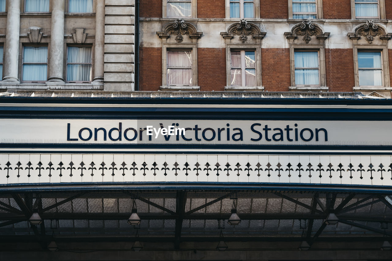 Station name sign outside victoria train station, one of the busiest railway stations in london, uk.