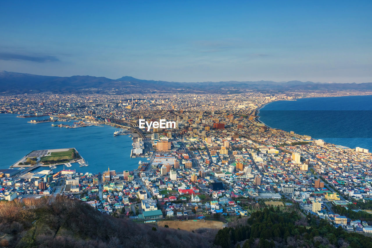 High angle view of city by sea