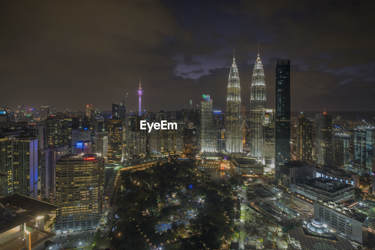 Aerial view of city lit up at night