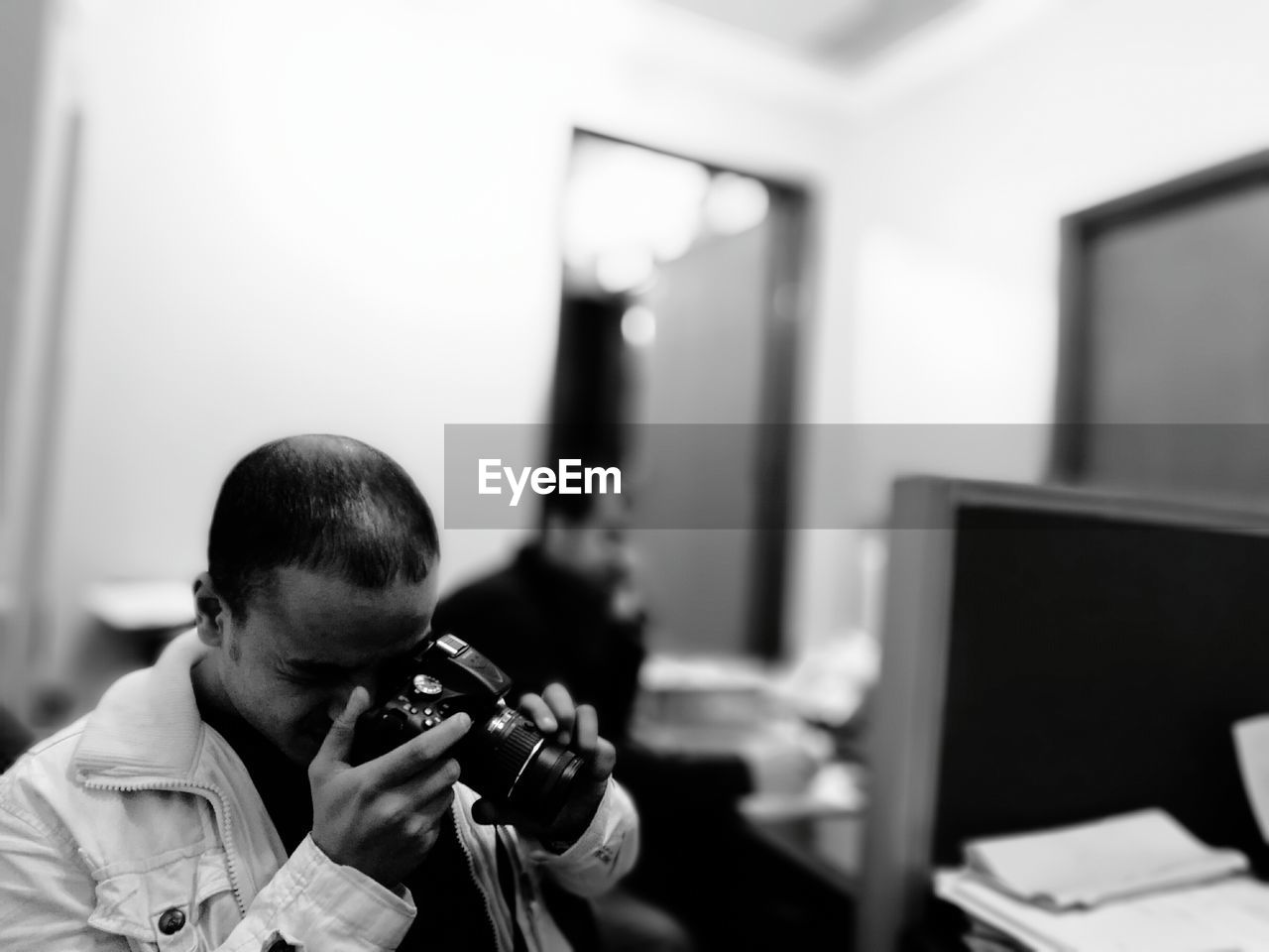 Man photographing in medical clinic