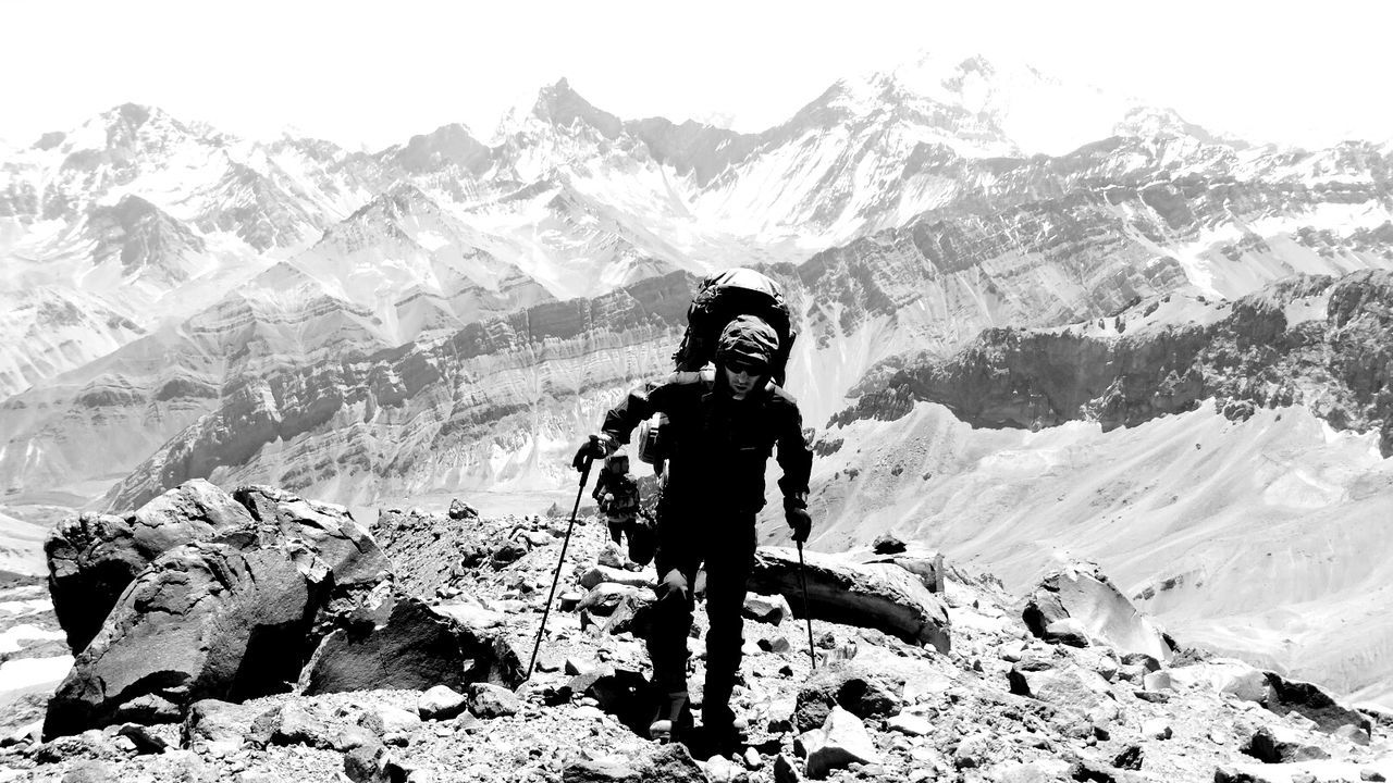 Full length of man hiking on mountain