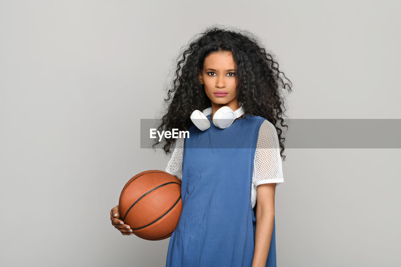 PORTRAIT OF A TEENAGE GIRL WITH BALL