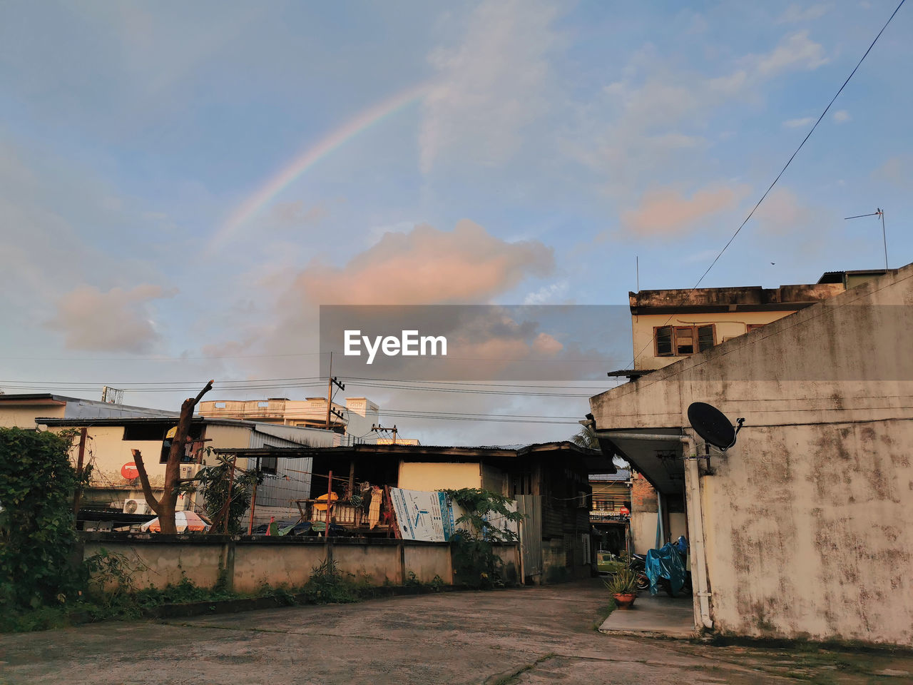 RAINBOW OVER BUILDINGS IN TOWN