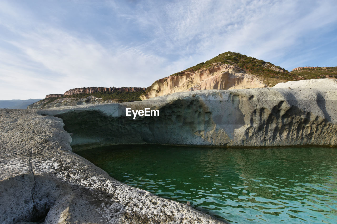 water, sea, coast, cliff, rock, sky, terrain, nature, scenics - nature, land, environment, beauty in nature, landscape, ocean, shore, travel destinations, bay, cloud, beach, travel, blue, no people, mountain, outdoors, wave, tourism, tranquility, day, lagoon, coastline, non-urban scene, geology, rock formation, tranquil scene, vacation