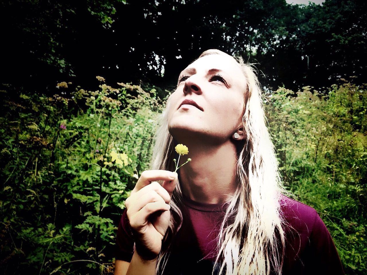 Close-up of woman holding flower