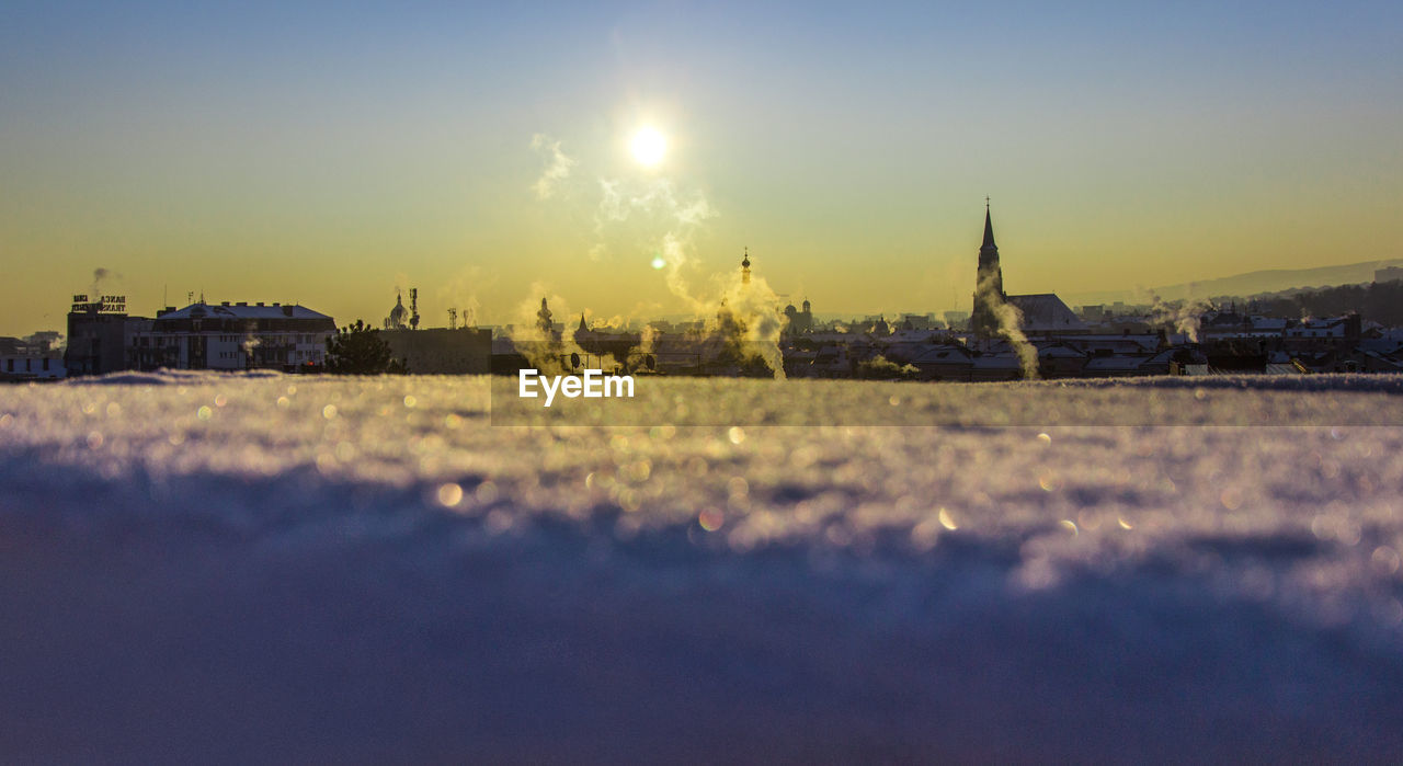 Panoramic view of buildings against sky during sunset