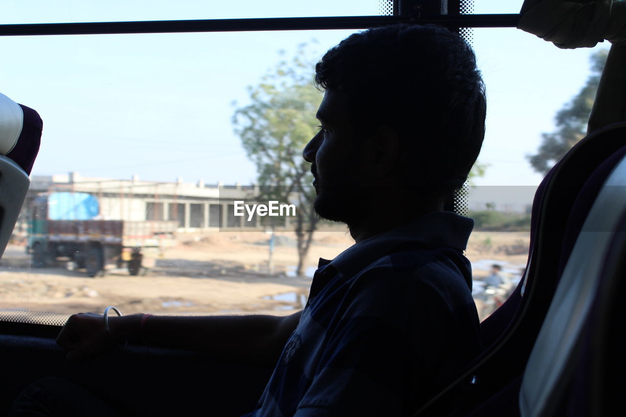 Man sitting in bus