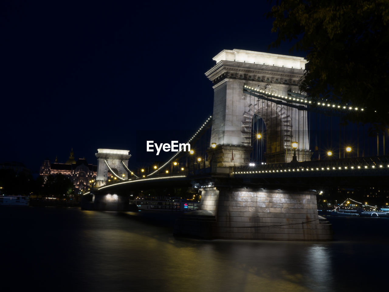 View of bridge over river against blue sky