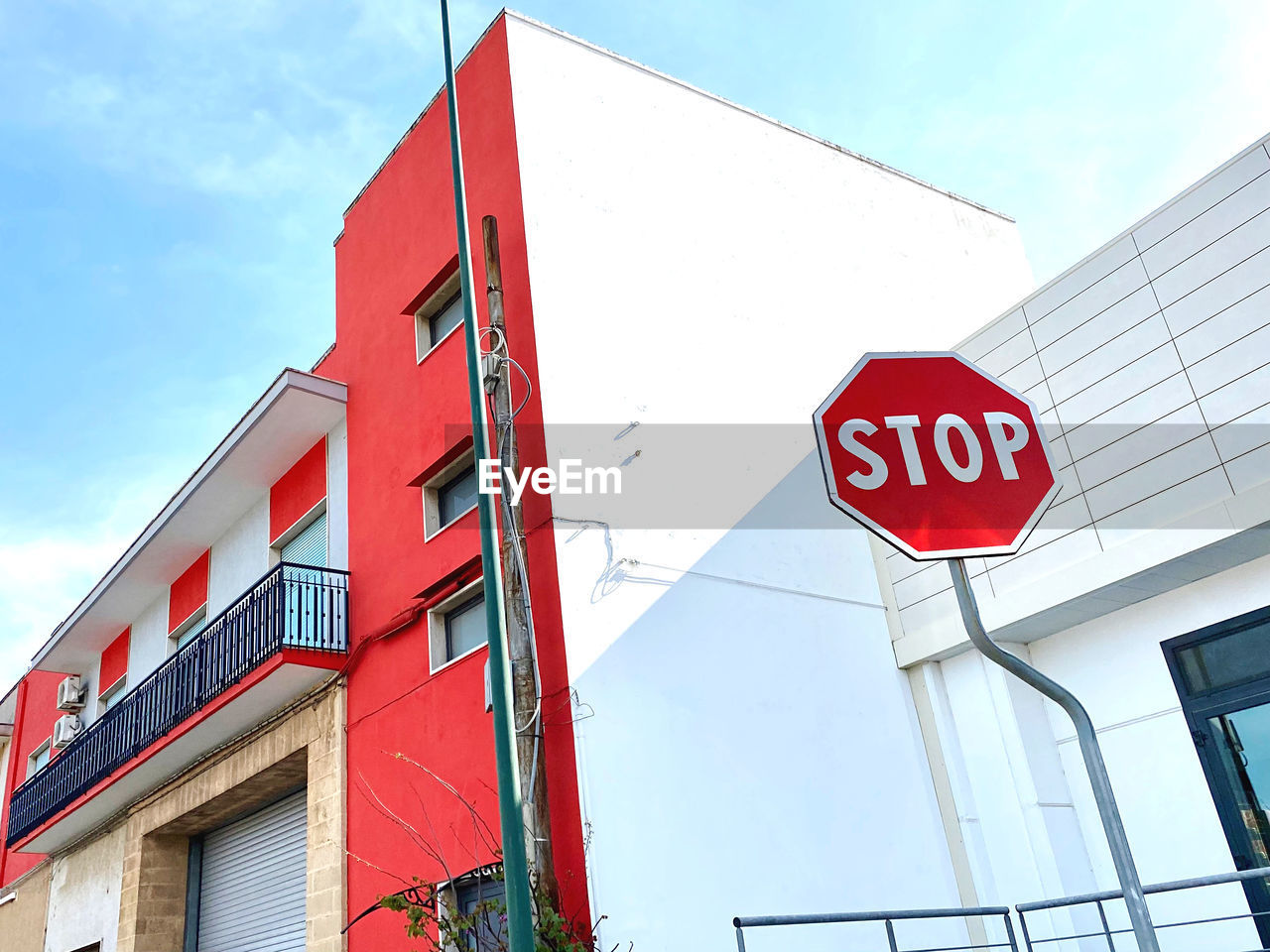 Low angle view of stop sign against building