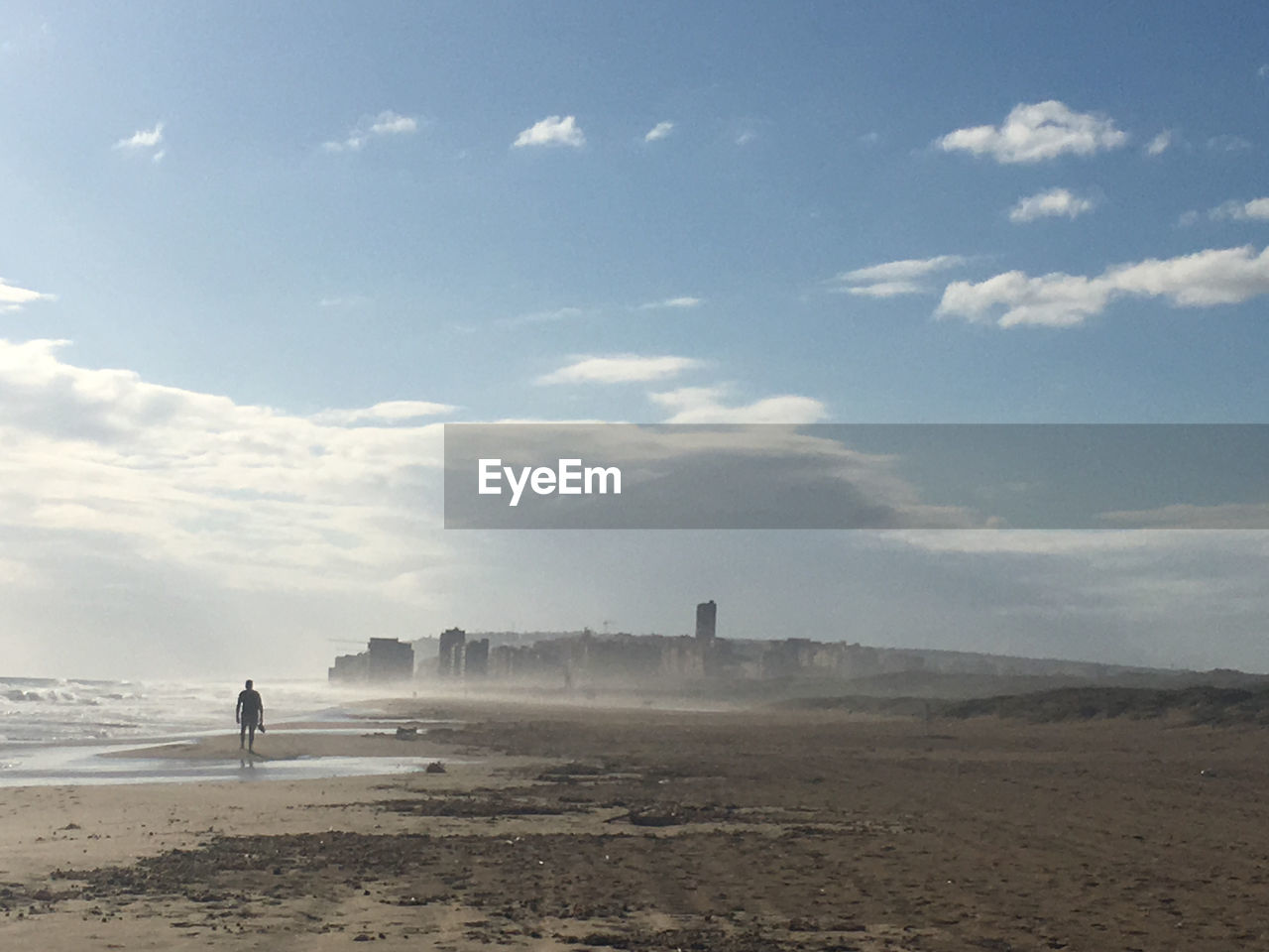 MAN STANDING ON BEACH