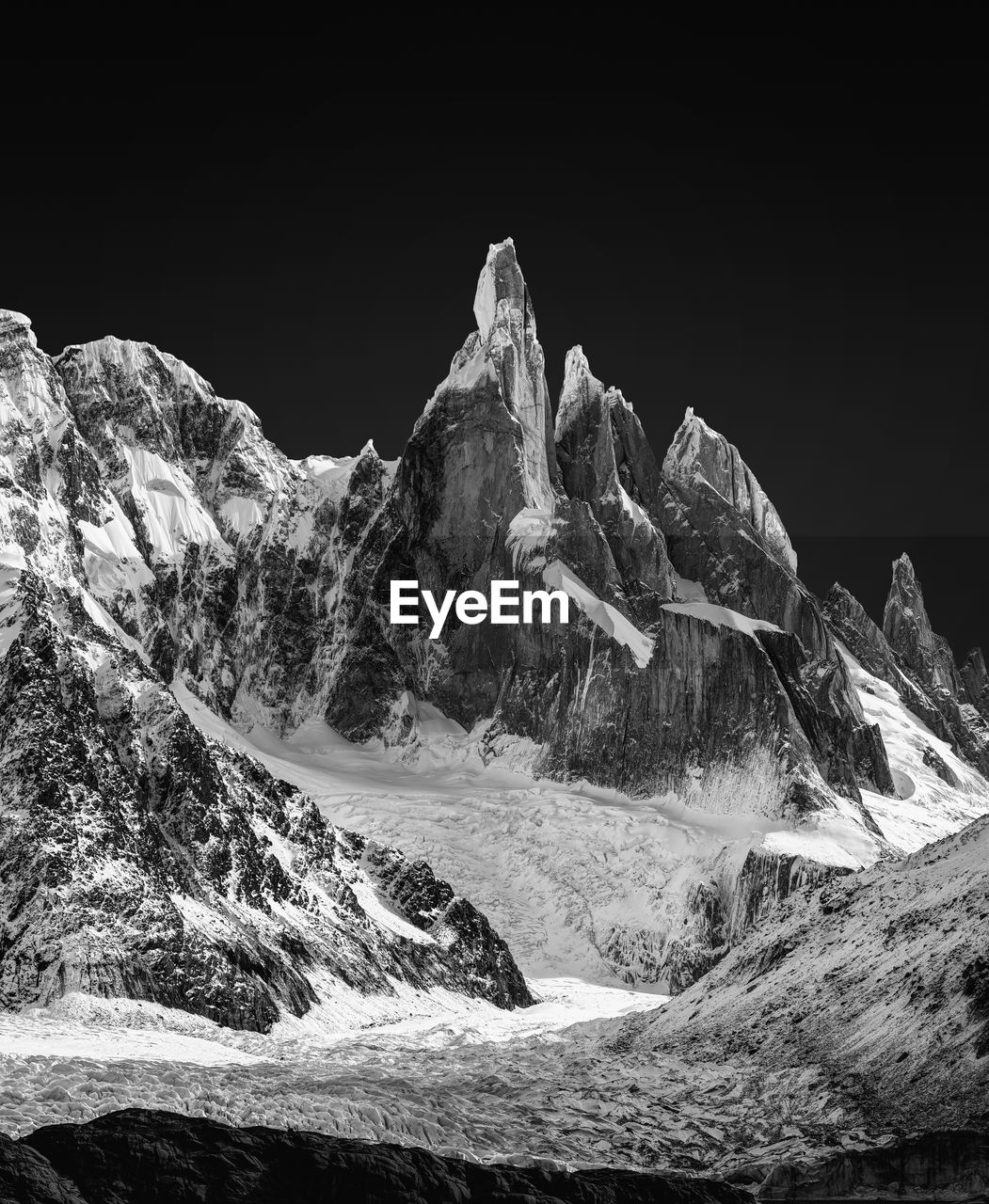Scenic view of snowcapped mountains against clear sky