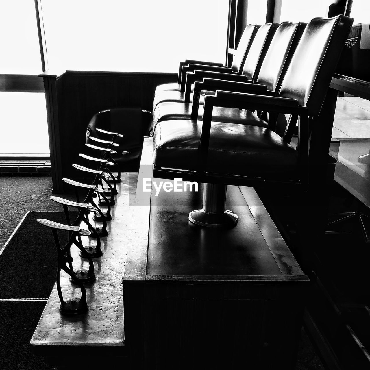 Empty chair with footrests in hall