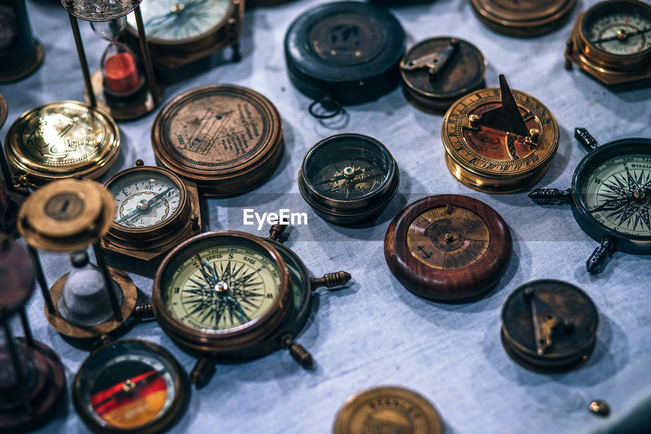 High angle view of navigational compasses at market stall