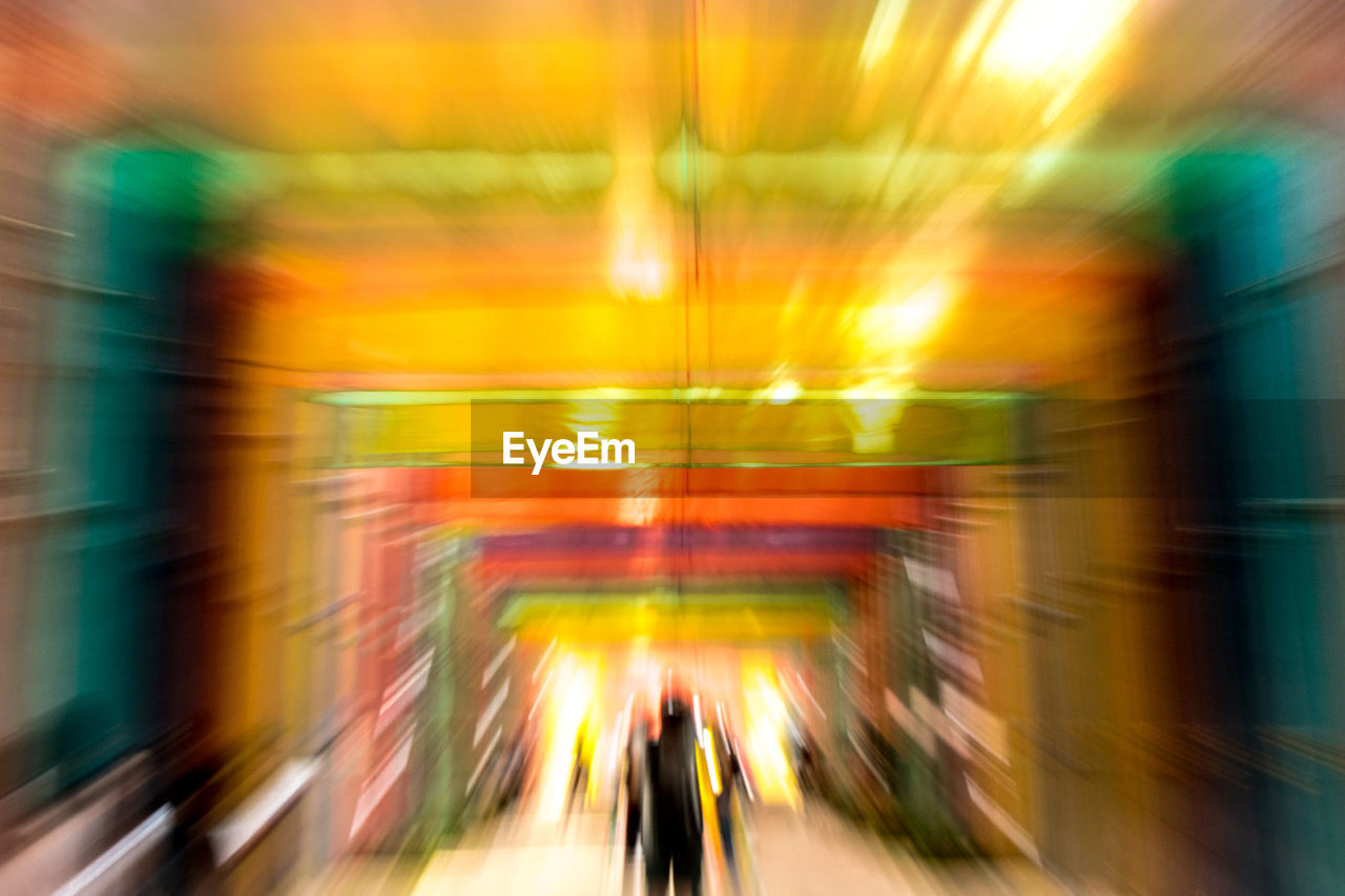 BLURRED MOTION OF PEOPLE ON SUBWAY STATION