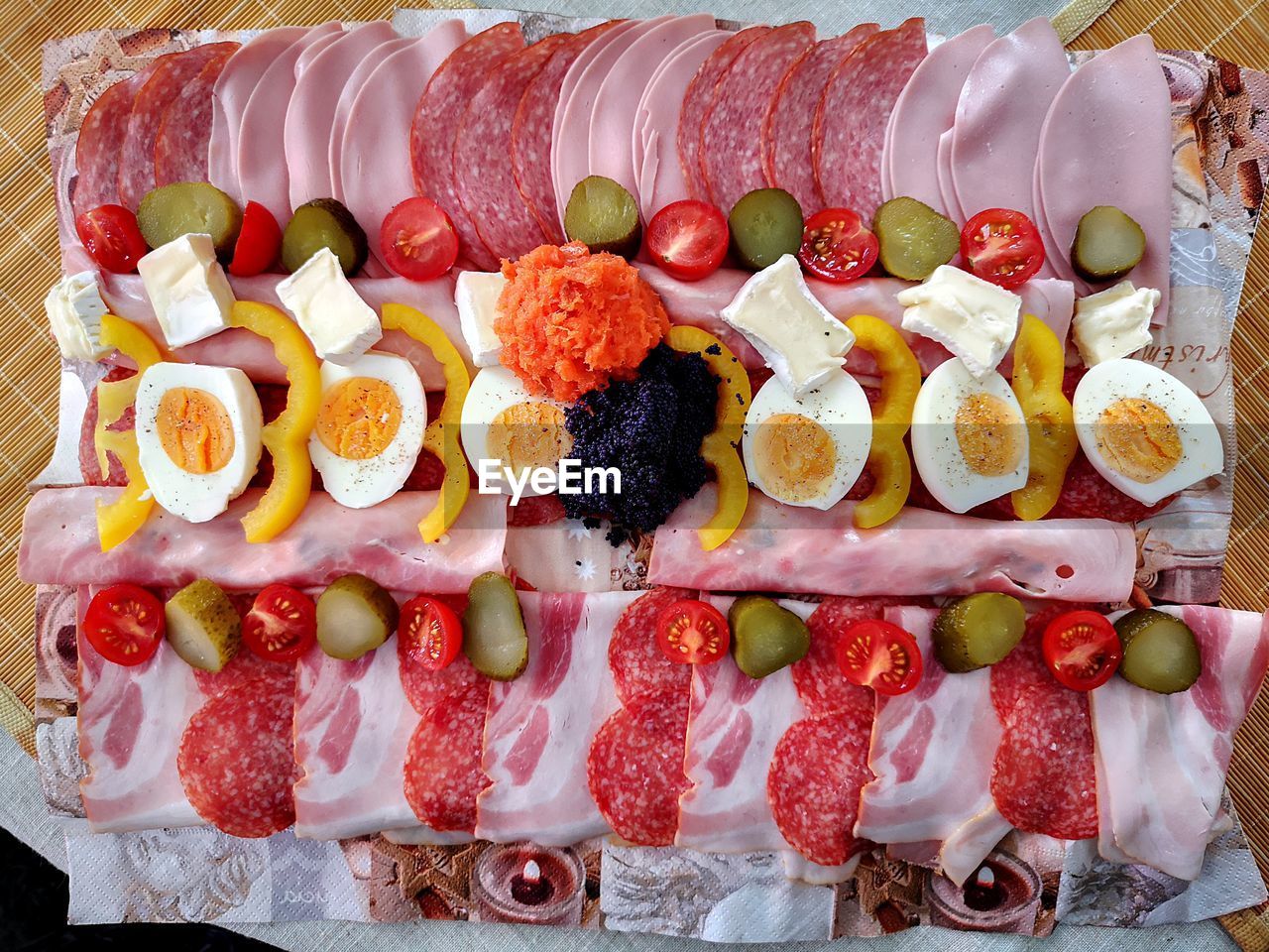 Served for the board snack for the birthday cavia, paprika, tomatoes, bacon and sausage