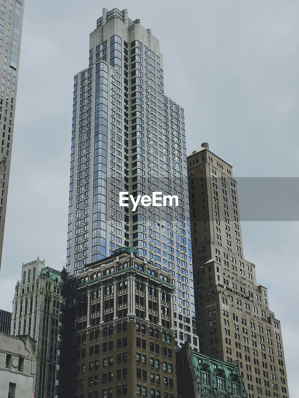 Low angle view of modern buildings against sky in city