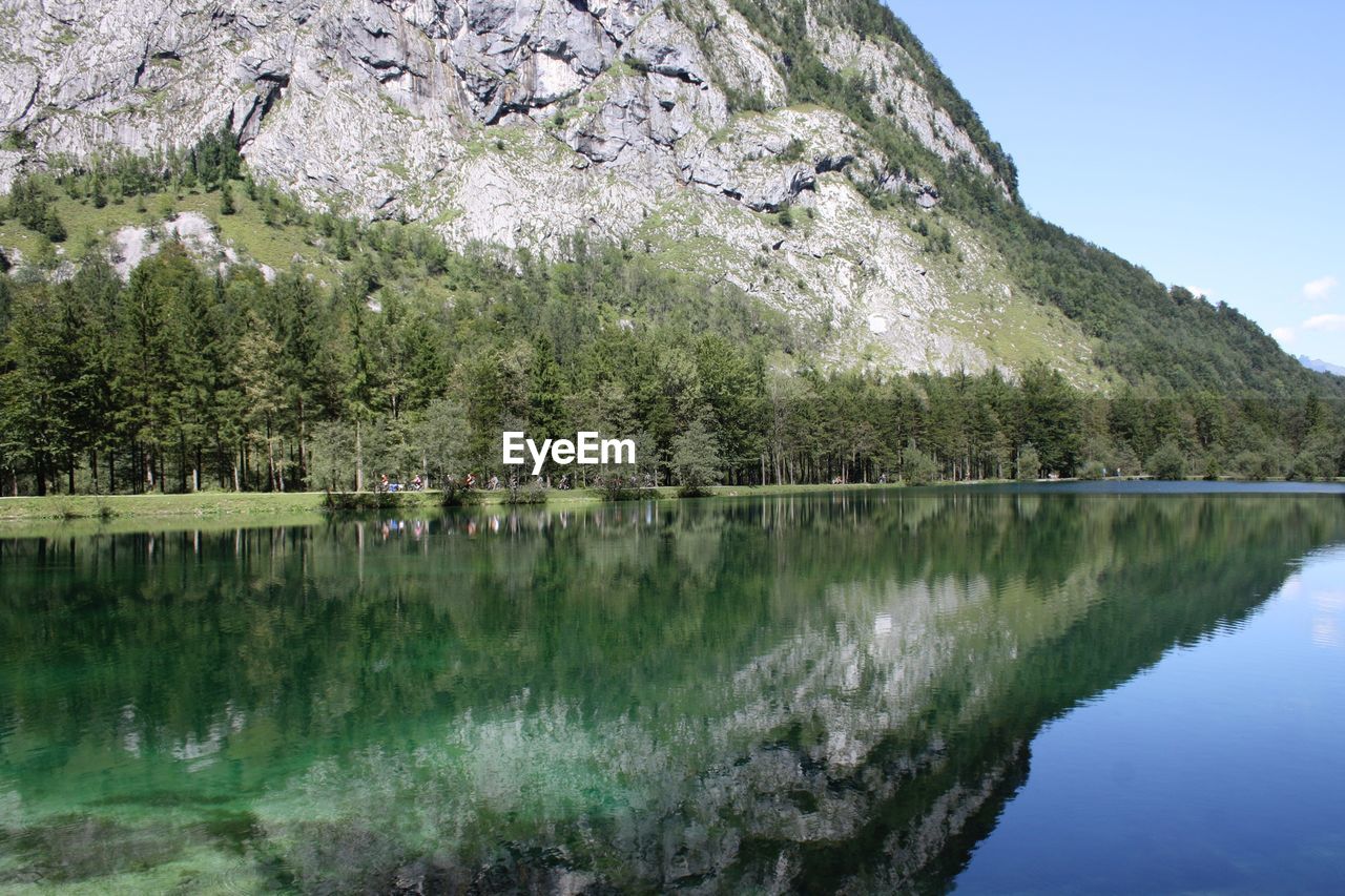 Idyllic shot of rocky mountain reflection in lake at bluntautal