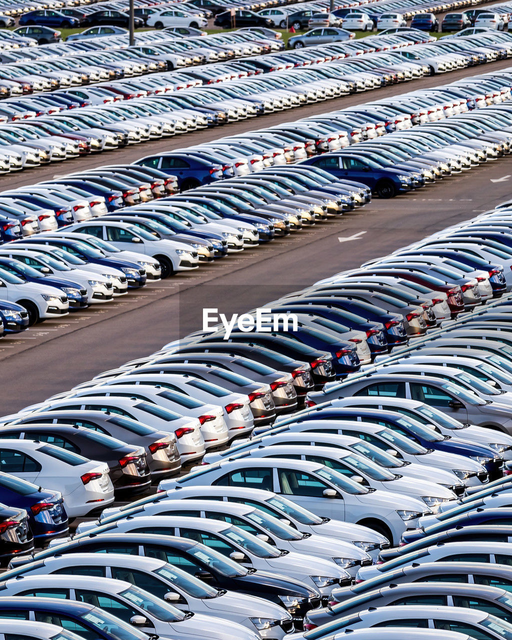 in a row, stadium, large group of objects, sport venue, high angle view, transportation, no people, order, race track, abundance, full frame, repetition, mode of transportation, day, architecture, motor vehicle, backgrounds, transport, car, vehicle, parking lot, city, outdoors, business, arrangement, side by side, arena, traffic congestion