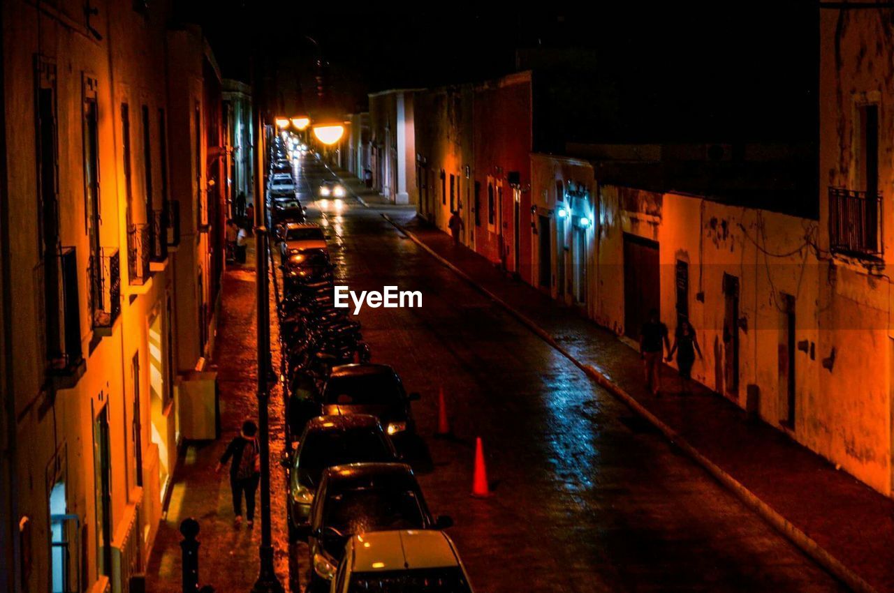 ILLUMINATED CITY STREET AT NIGHT