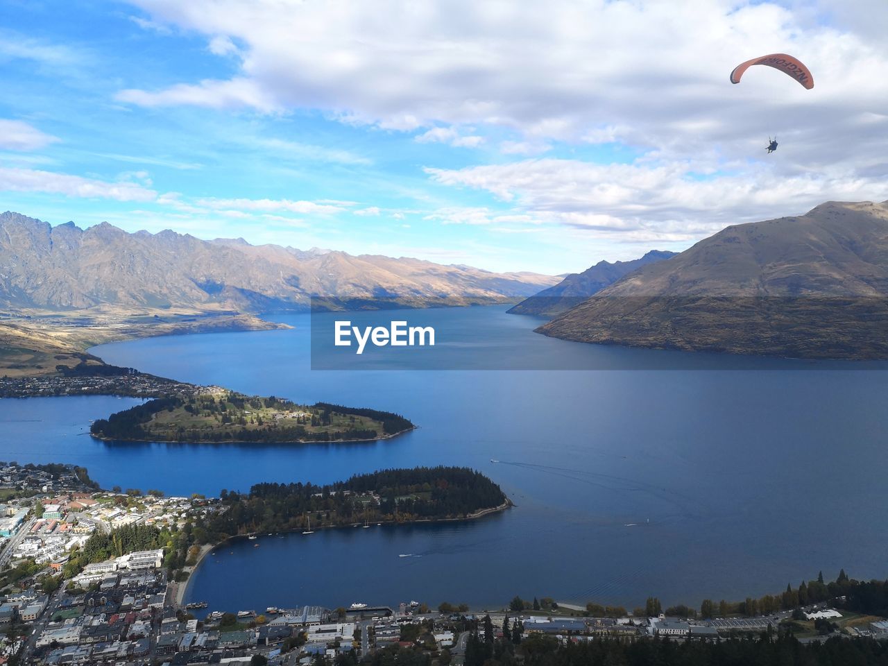 Scenic view of lake and mountains against sky