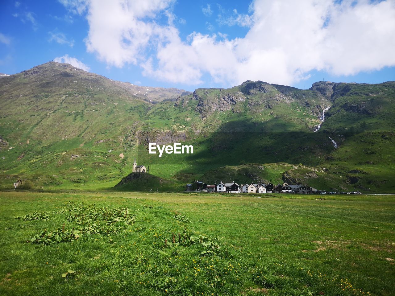 SCENIC VIEW OF GREEN LANDSCAPE AGAINST SKY