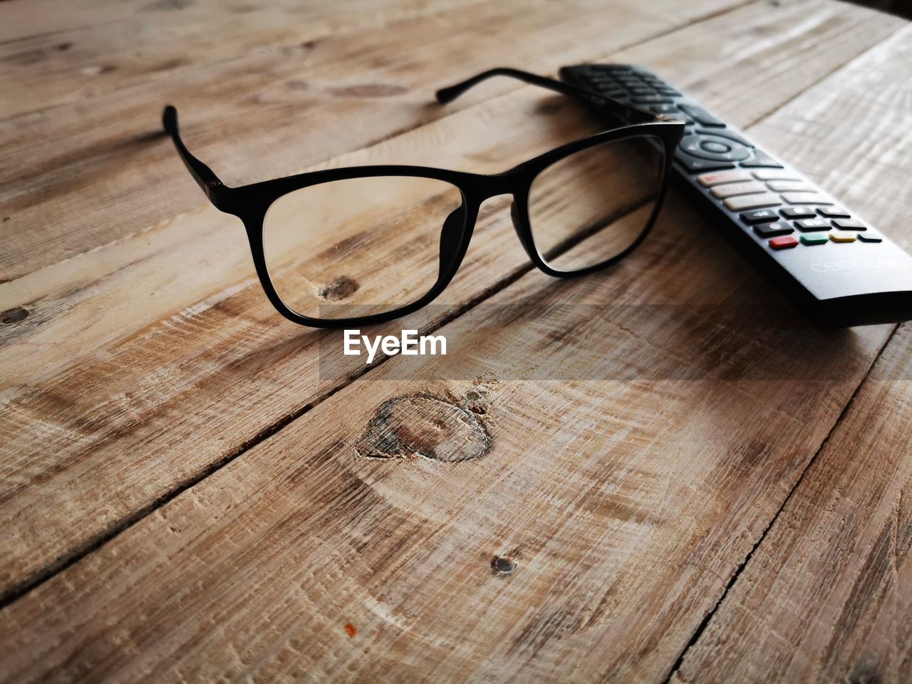 glasses, vision care, eyewear, eyeglasses, wood, table, brown, indoors, no people, still life, close-up, high angle view