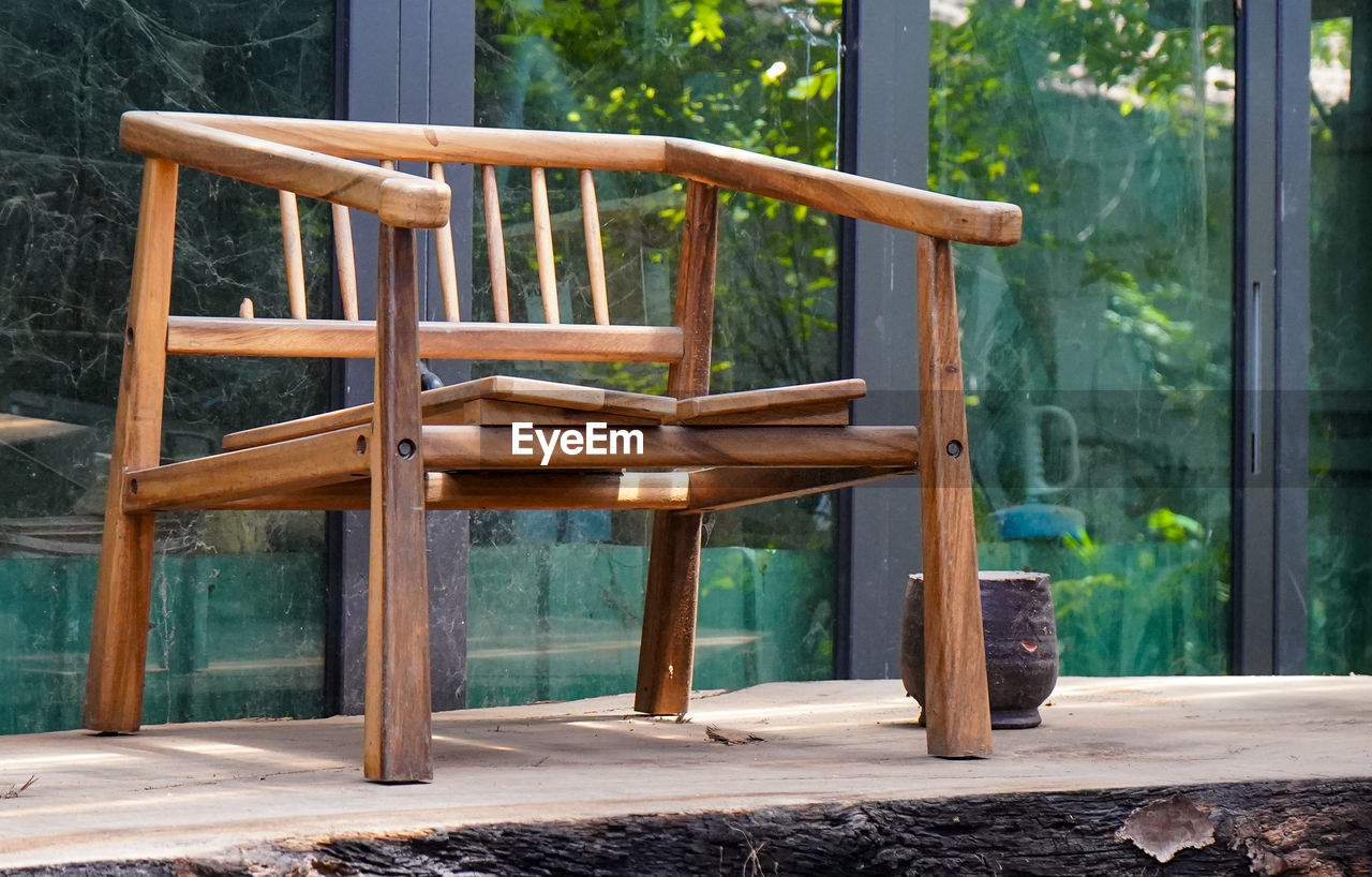 wood, seat, chair, nature, tree, no people, plant, architecture, furniture, relaxation, day, outdoors, empty, built structure, absence, tranquility, table, land, summer, backyard, sunlight