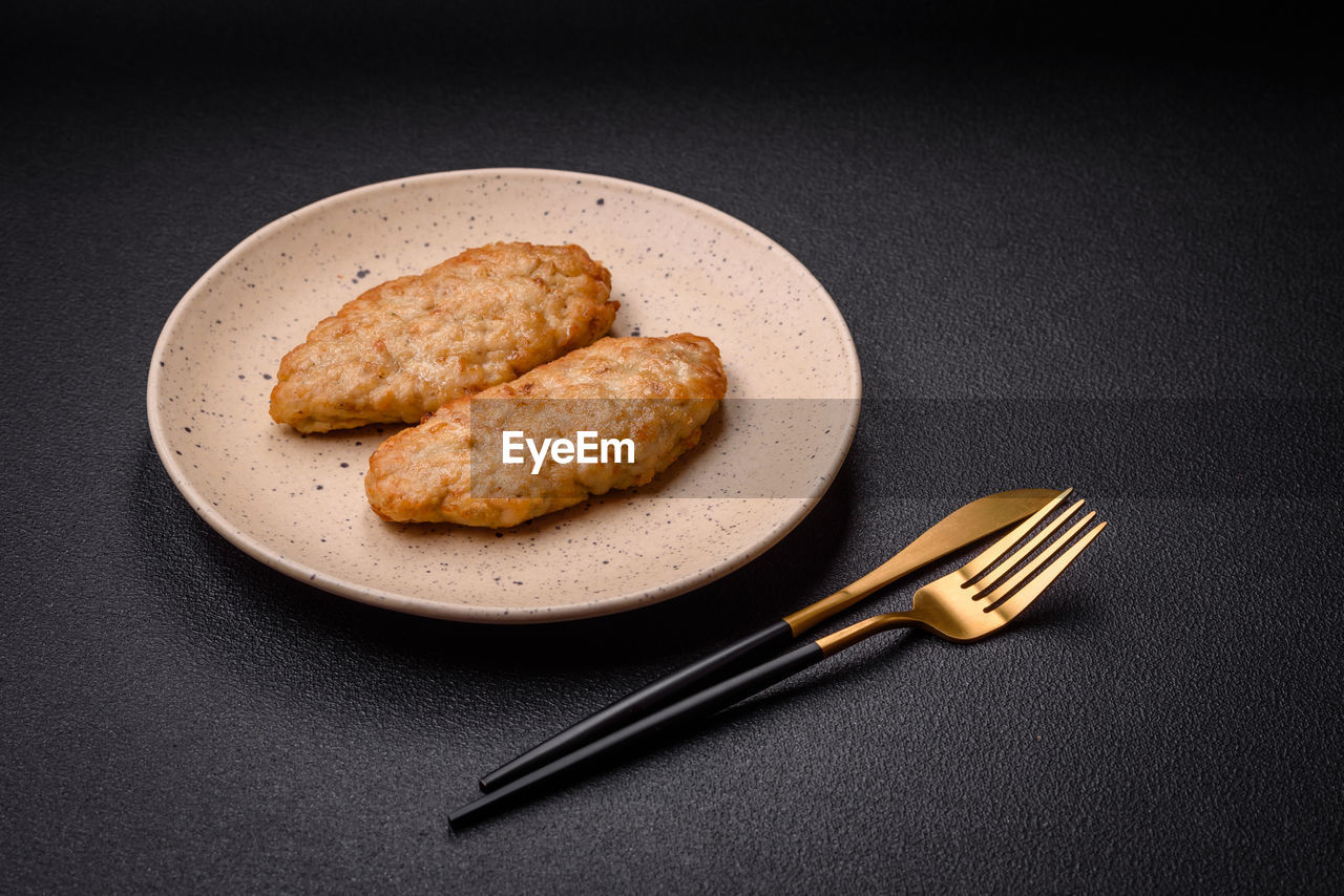 food and drink, food, studio shot, freshness, indoors, plate, no people, black background, still life, kitchen utensil, baked, bread, dessert, simplicity, wellbeing, healthy eating, breakfast, eating utensil, fork, dish, table, meal, high angle view, close-up