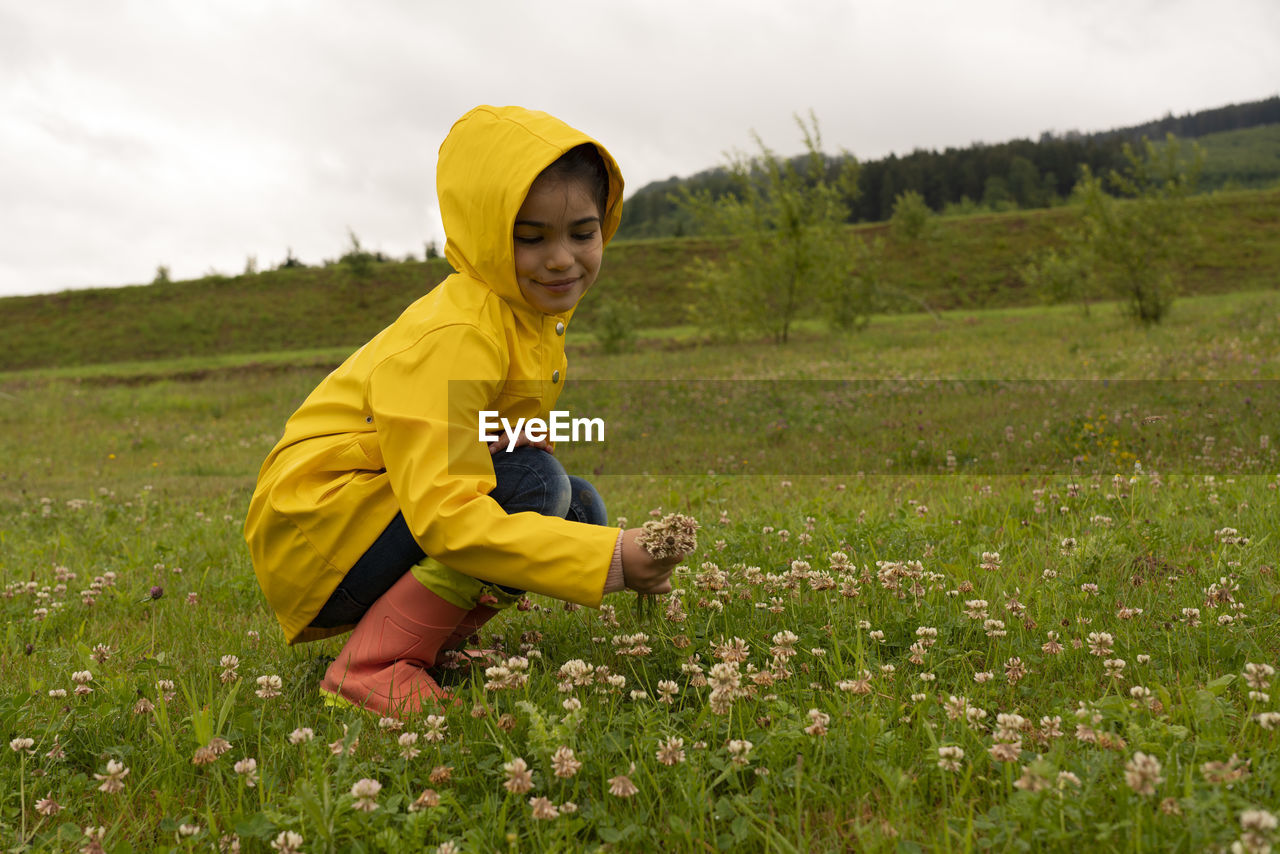 Cute girl holding flowers, being thankful....