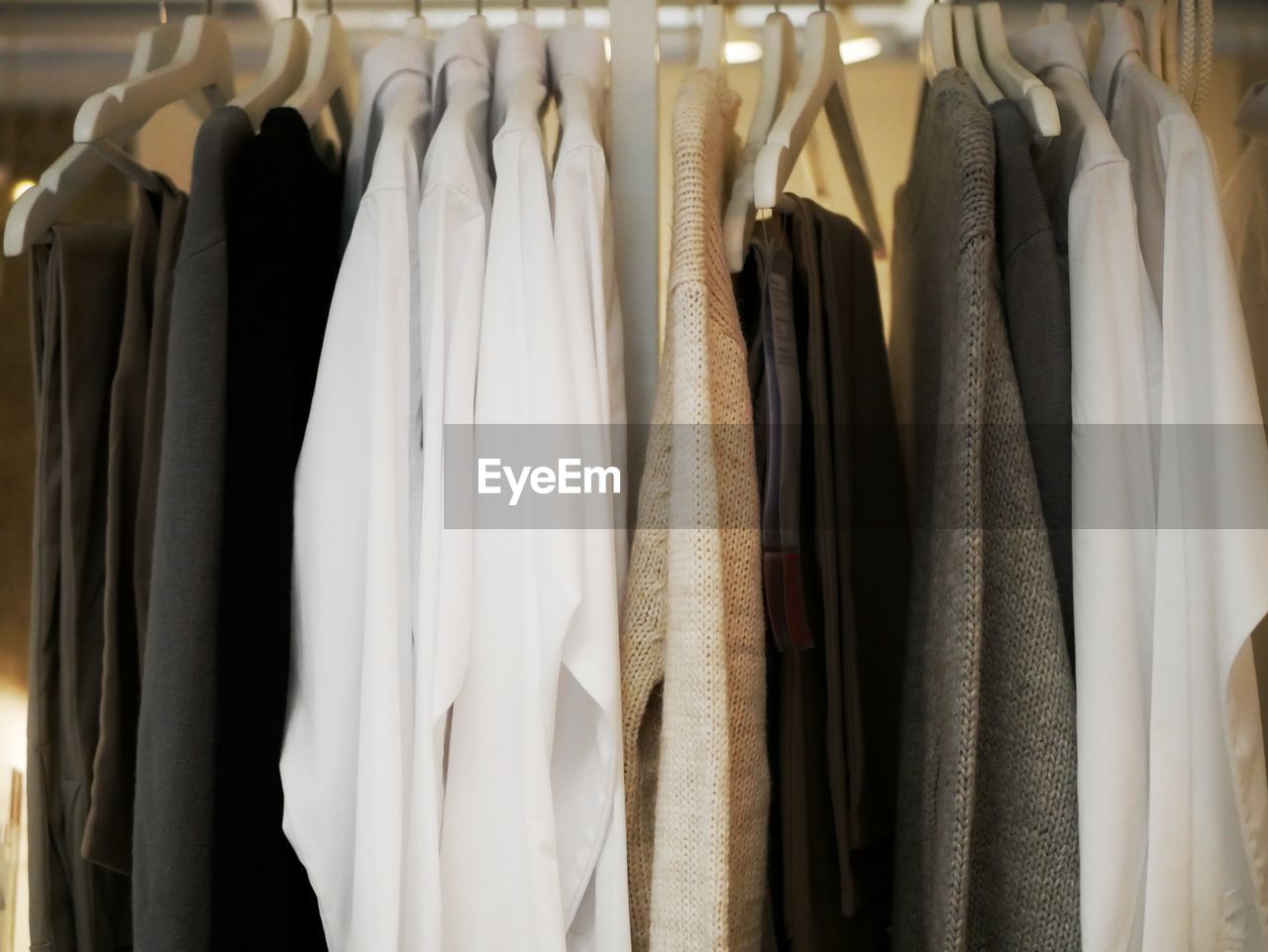 Clothes hanging on rack in store