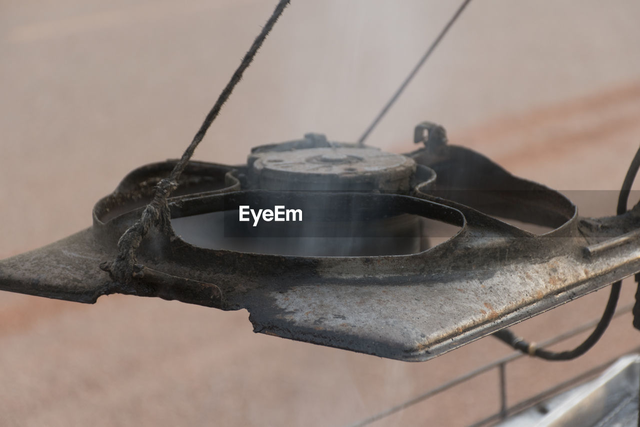 High angle view of metal structure on wood