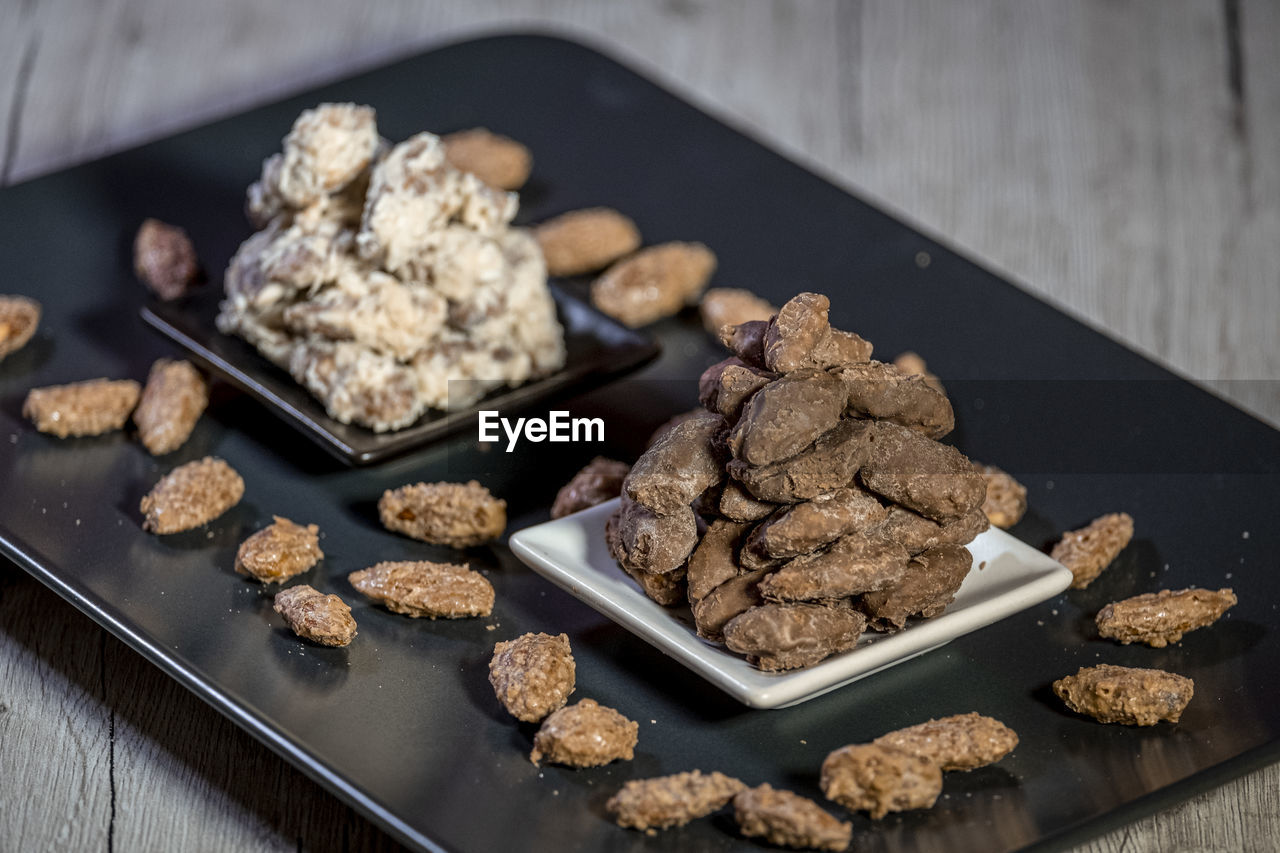 High angle view of nuts in plate on table