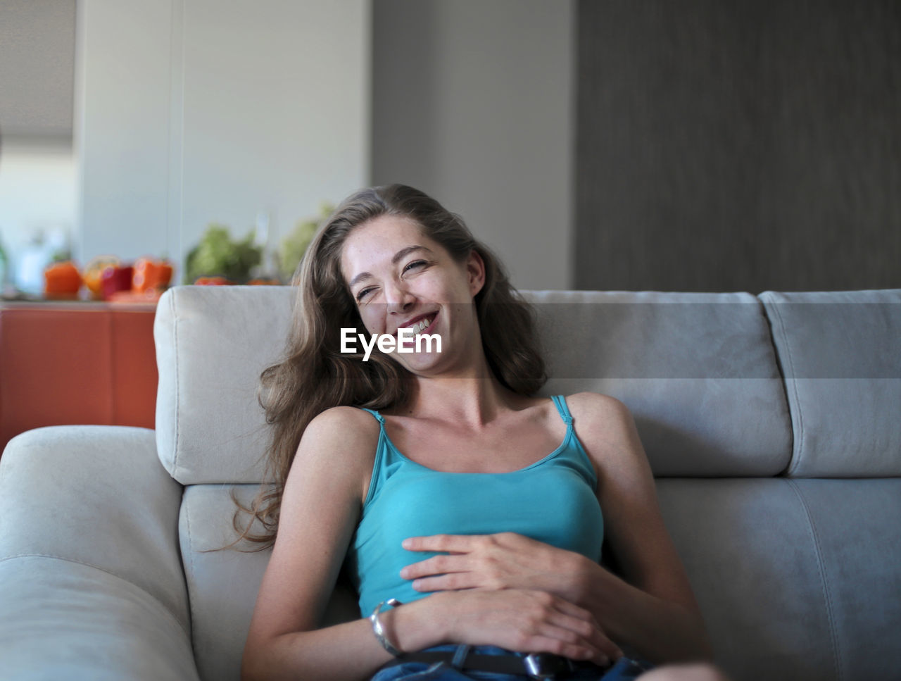 Portrait of beautiful laughing woman at home