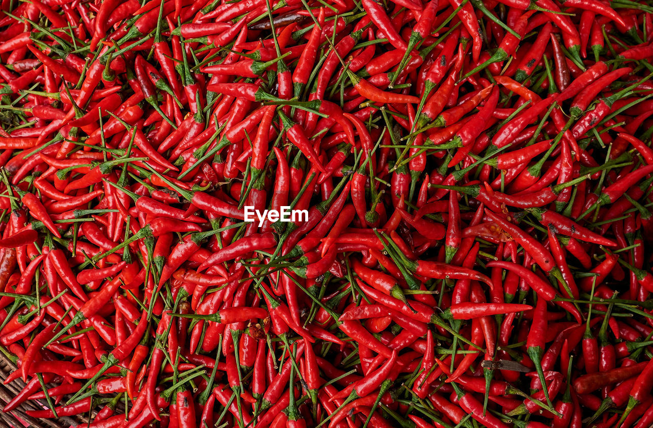 Full frame shot of red chili peppers at market for sale
