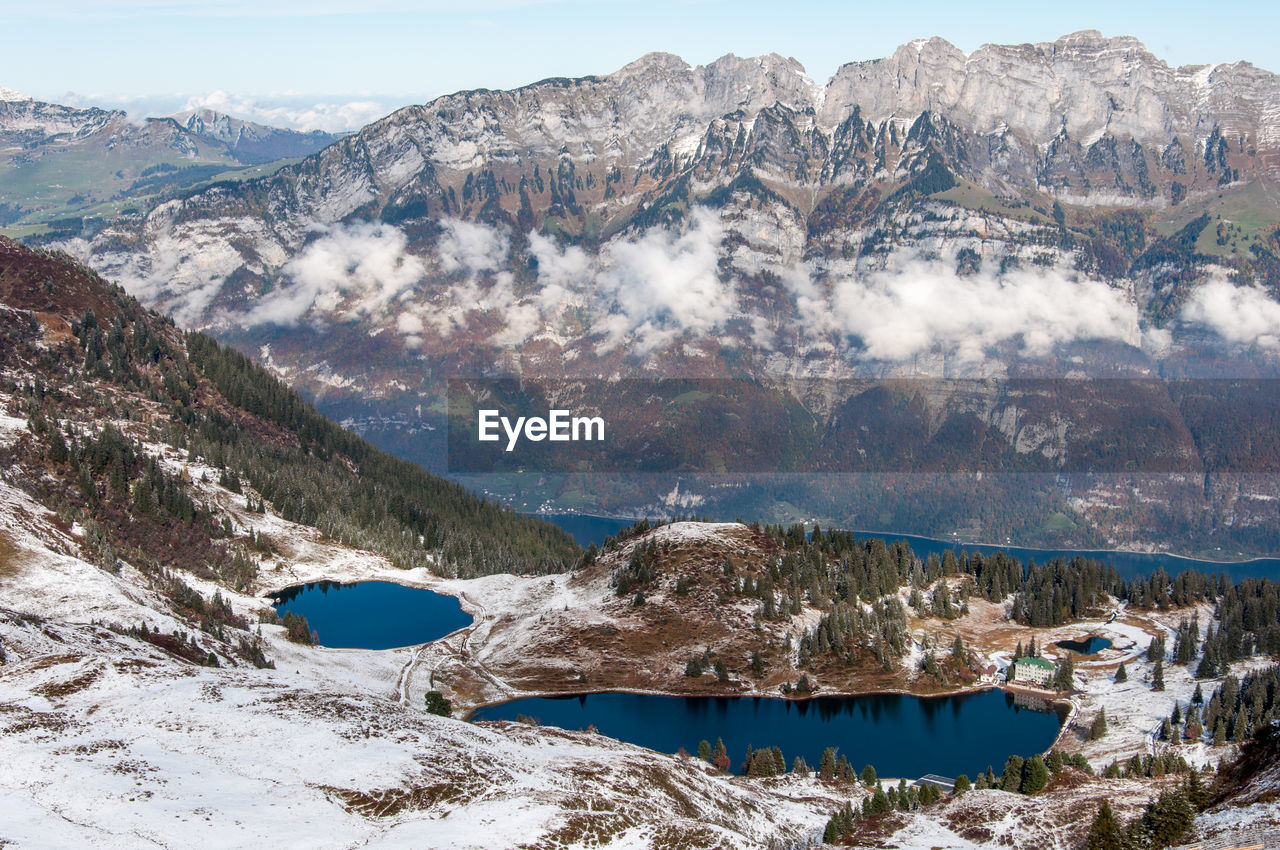 Scenic view of mountain range during winter