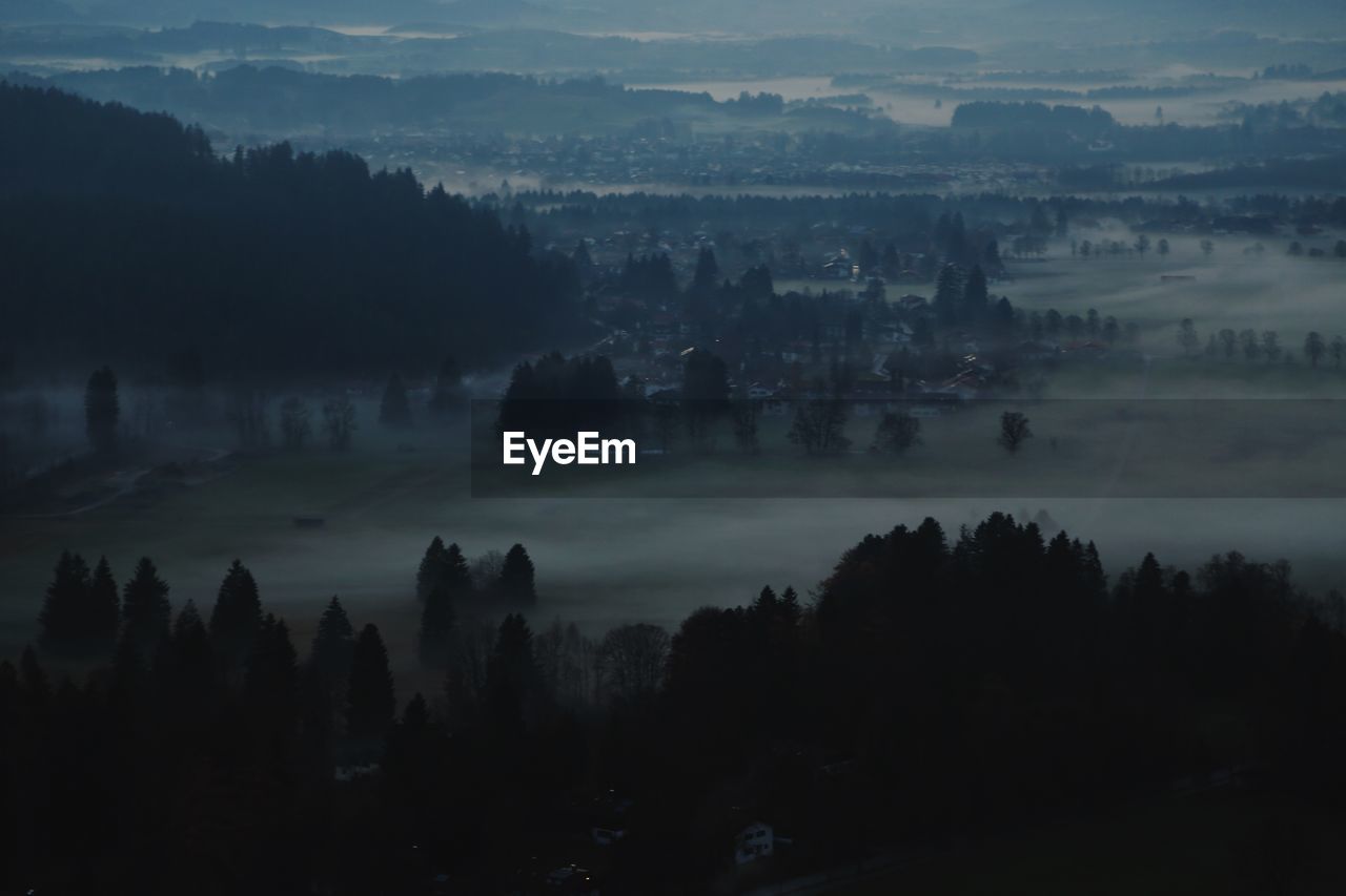 High angle view of silhouette landscape against sky