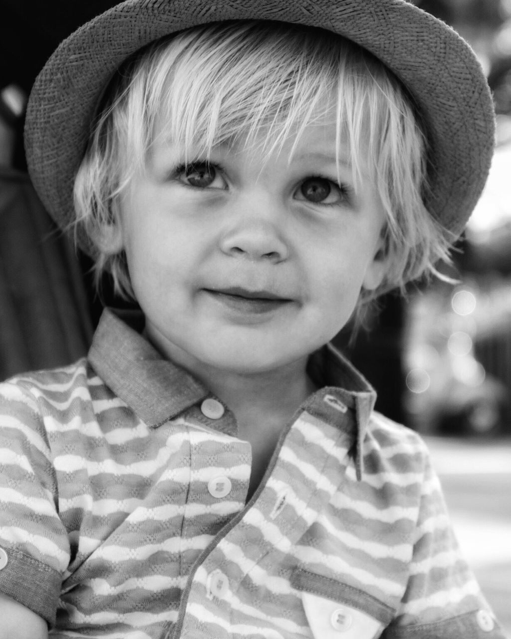 Close-up of boy wearing hat