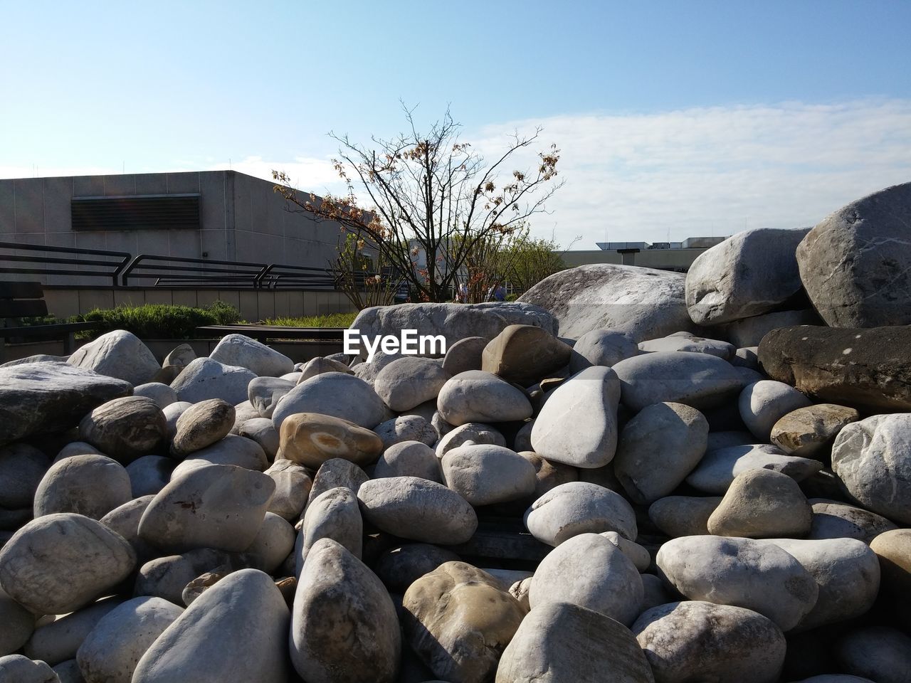 Stones by built structure against sky