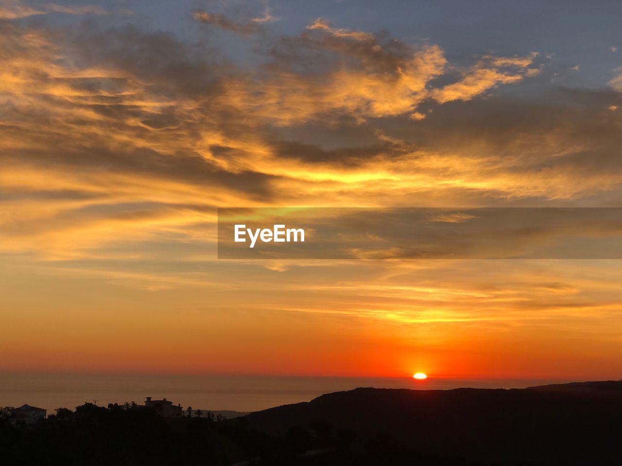 SCENIC VIEW OF SEA AGAINST ORANGE SKY