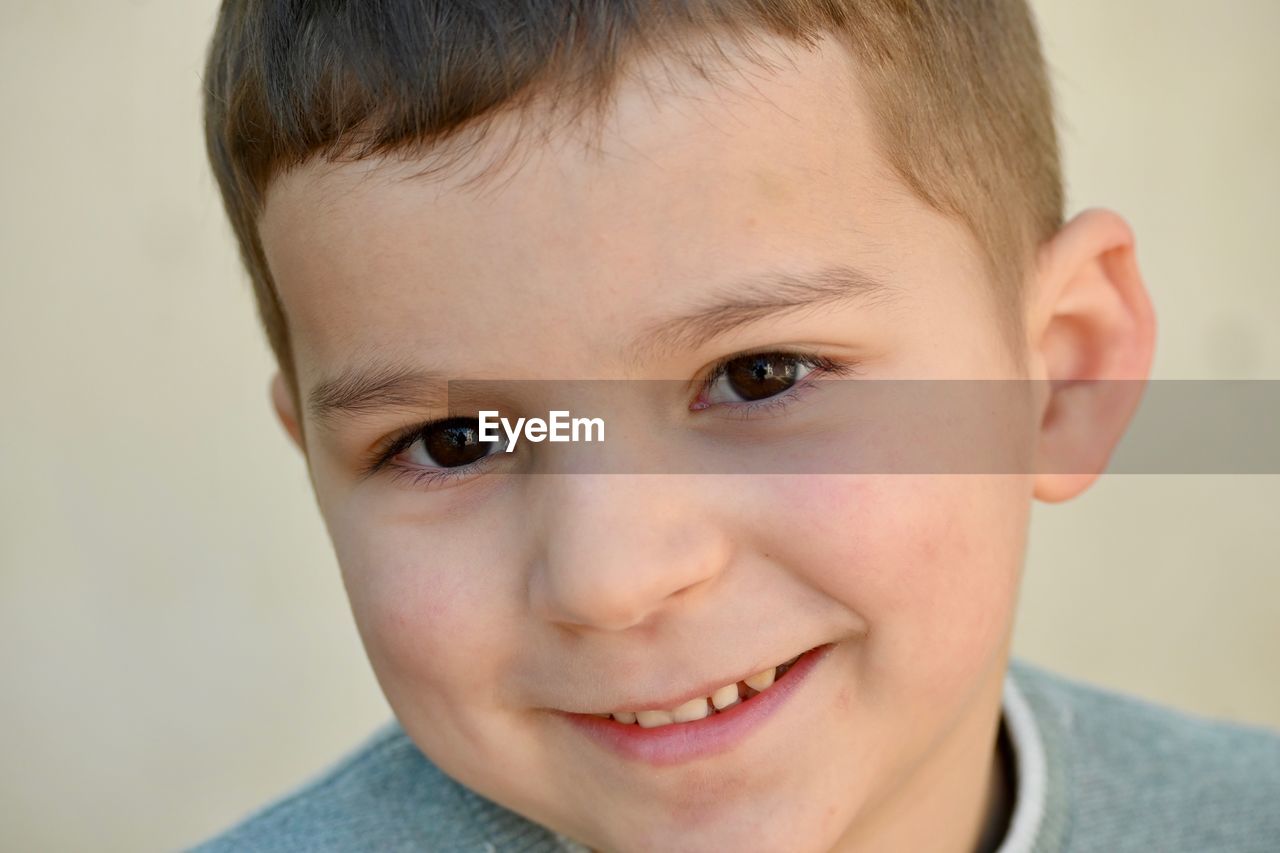 Close-up portrait of smiling boy