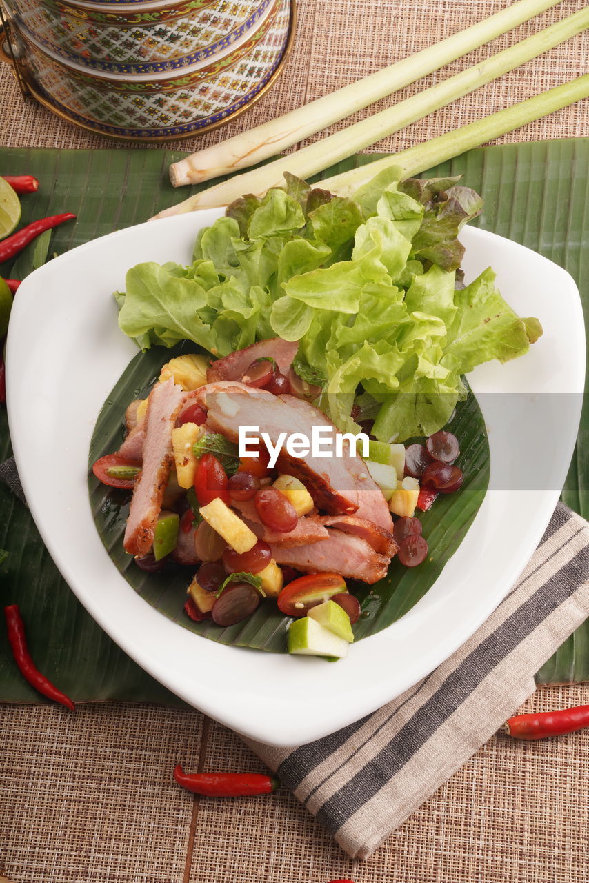 High angle view of thai food in plate on table
