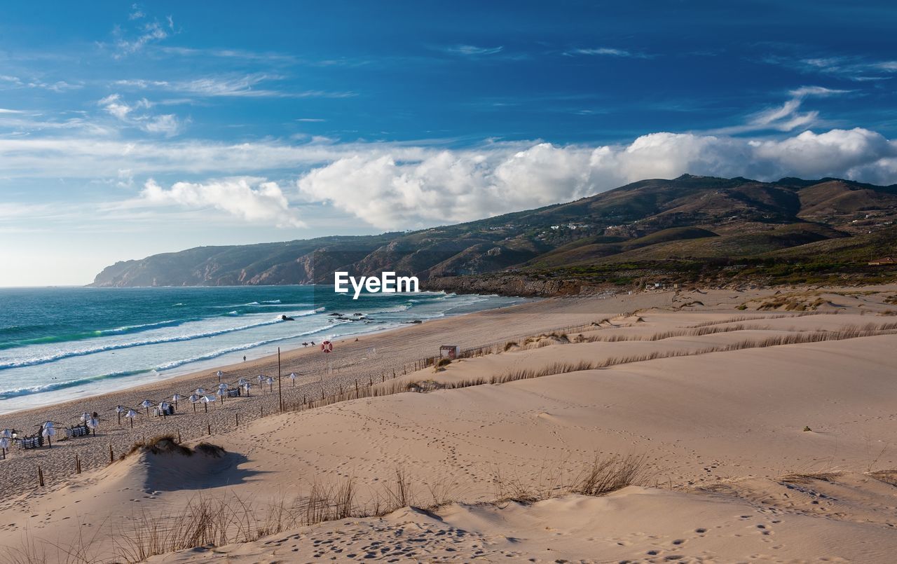 Scenic view of beach against sky