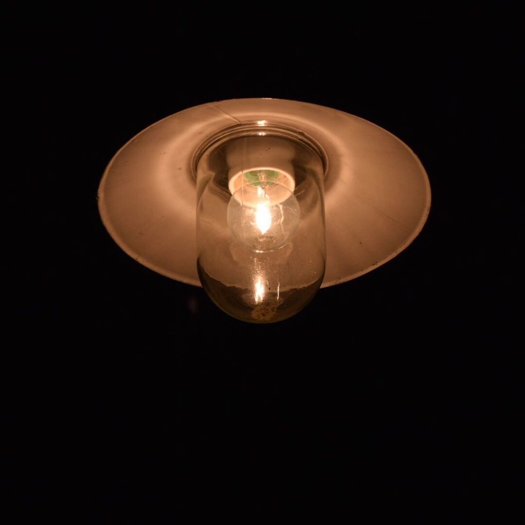 CLOSE-UP OF ILLUMINATED LIGHT BULB