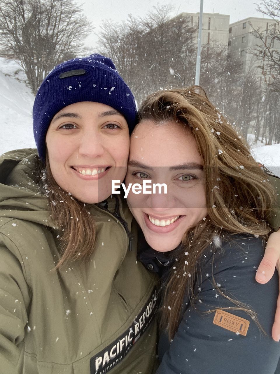 smiling, portrait, happiness, winter, emotion, cold temperature, adult, two people, women, snow, looking at camera, young adult, togetherness, skin, headshot, positive emotion, enjoyment, cheerful, leisure activity, nature, warm clothing, fun, clothing, female, person, lifestyles, child, men, bonding, high angle view, human face, lying down, day, teeth, outdoors, snowing, smile, friendship, love, photo shoot, wet, water